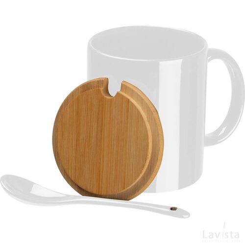 Kopje met een bamboedeksel en lepel wit
